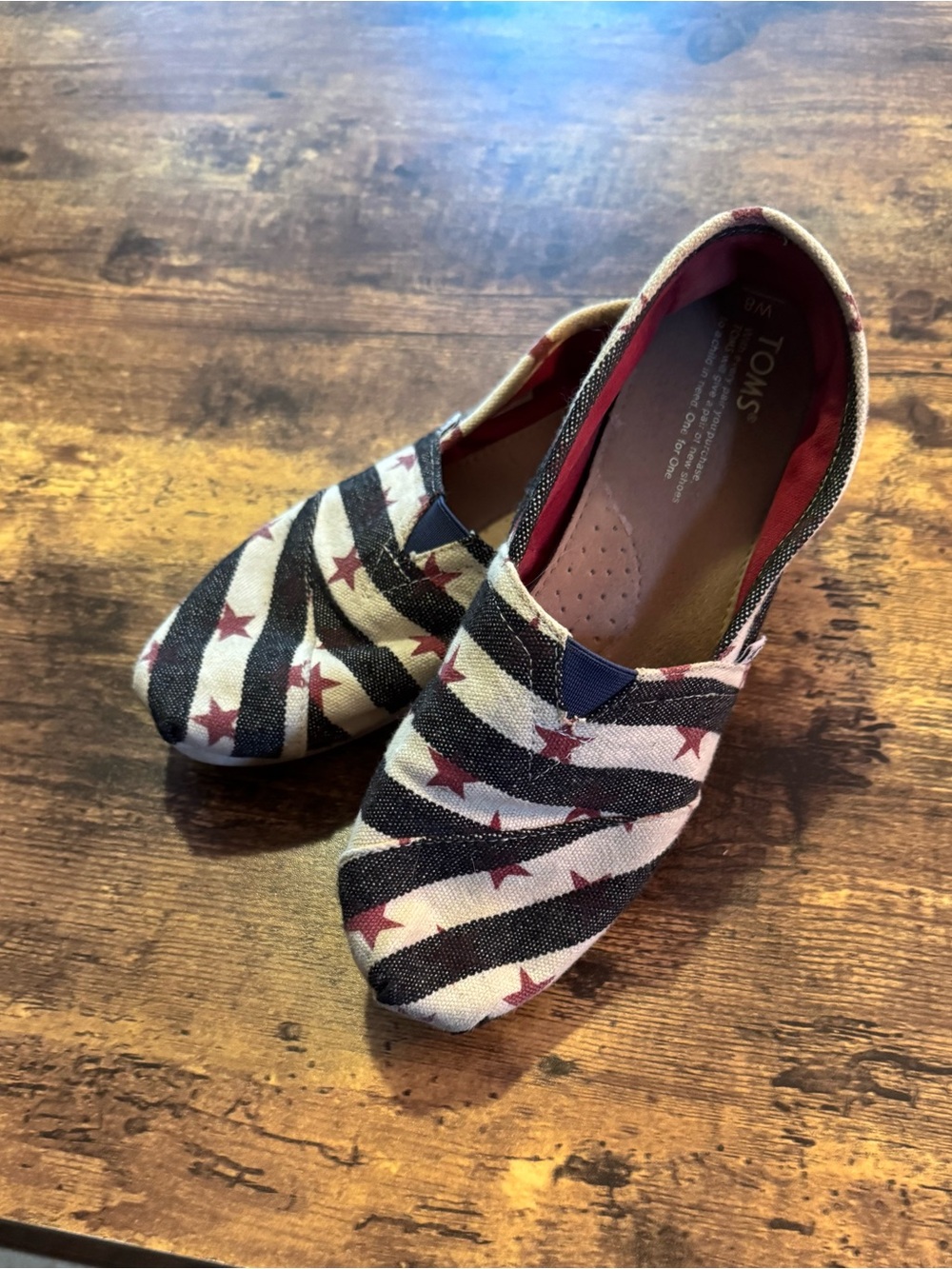 TOMS Slip-On Sneakers in Navy, Cream, and Red Star Stripe